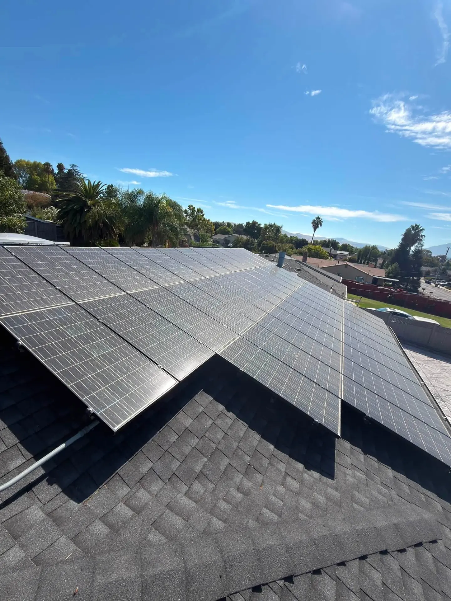 Clean solar panels reflecting a clear Bay Area sky